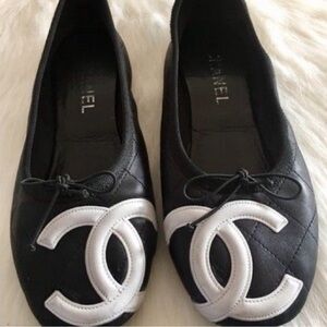 CHANEL Quilted Black and White Loafers 
ISO!!